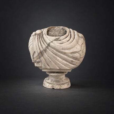 199. Headless bust of a man in a toga, carved from