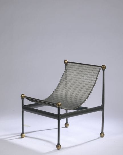 WORK FROM THE 1980s–1990s
Armchair with a metal fr