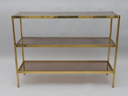 Consola de latón dorado con montantes finamente ac