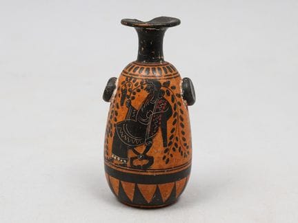 Lécythe de terracota esmaltada con fondo de color 