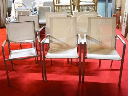 Six metal outdoor chairs with wooden armrests, two