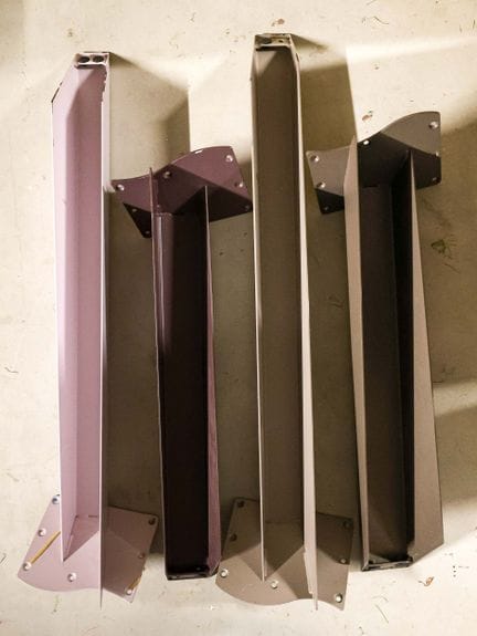 Four table legs made of pink and purple lacquered 