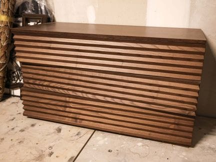Carved exotic wood chest of drawers with three asy