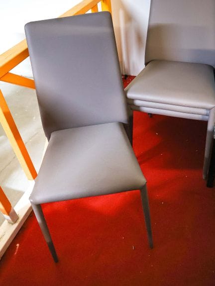 Eight brown faux-leather chairs
H: 94 cm