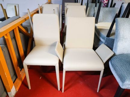 Six chairs and one armchair in beige faux leather,