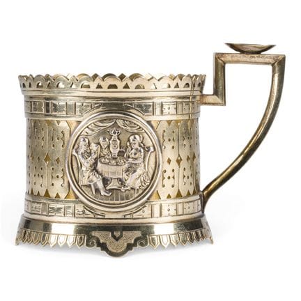 A FINE SILVER TEA-GLASS HOLDER WITH TEA DRINKERS A