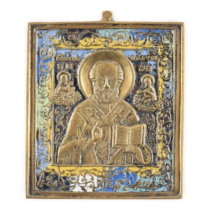 A BRASS AND ENAMEL ICON SHOWING ST. NICHOLAS OF MY