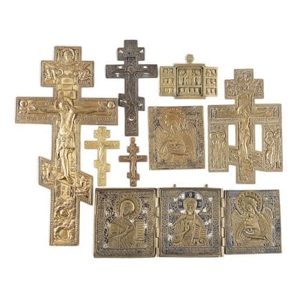 A COLLECTION OF EIGHT BRASS ICONS DEPICTING CRUCIF