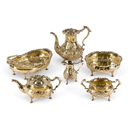 A MASSIVE SIX-PIECE SILVER-GILT SERVICE WITH FLORA