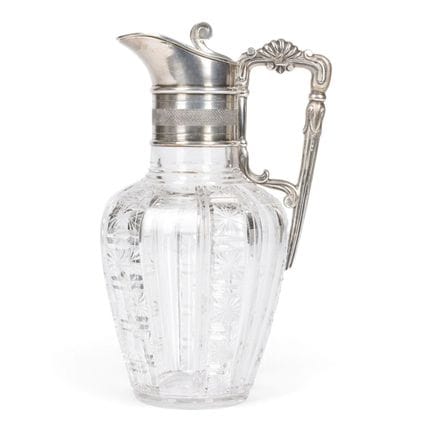 A GLASS DECANTER WITH SILVER MOUNT AND FOLIATE HAN