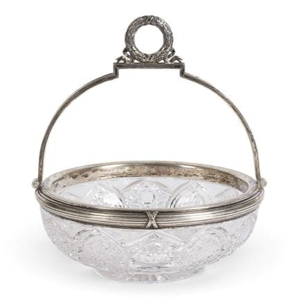 A GLASS BASKET WITH HANDLE AND LAUREL GARLAND Prob