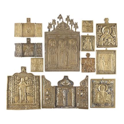 A COLLECTION OF TWELVE BRASS ICONS DEPICTING SELEC
