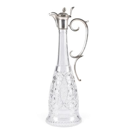 A LARGE SILVER-MOUNTED GLASS DECANTER WITH PINE-CO