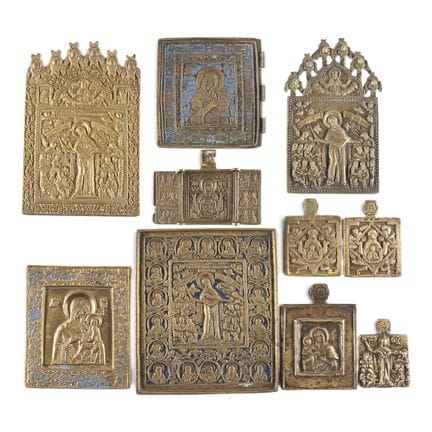 A COLLECTION OF TEN BRASS ICONS DEPICTING IMAGES O