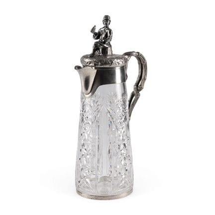 A LARGE GLASS DECANTER WITH A DRINKING PEASANT Rus