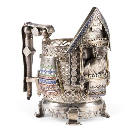 A VERY FINE FIGURAL SILVER AND CHAMPLEVÉ ENAMEL TE