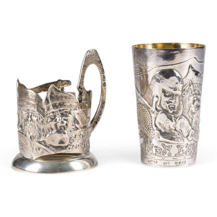 A MASSIVE SILVER TEA-GLASS HOLDER AND A LARGE BEAK