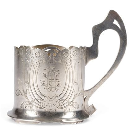 AN ART NOUVEAU SILVER TEA-GLASS HOLDER WITH ENGRAV