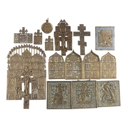 A COLLECTION OF TEN BRASS ICONS DEPICTING IMAGES O