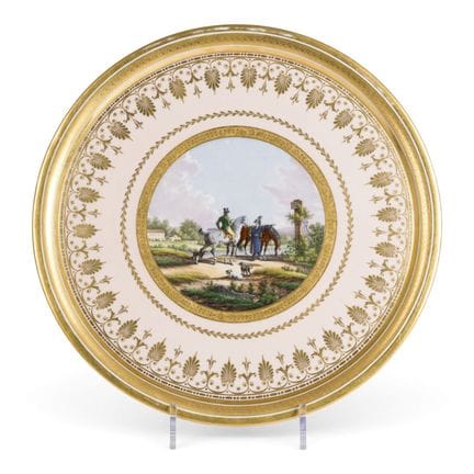 A ROUND PORCELAIN TRAY DEPICTING TWO HORSE RIDERS 