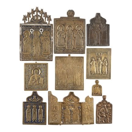 A COLLECTION OF TEN BRASS ICONS DEPICTING SELECTED