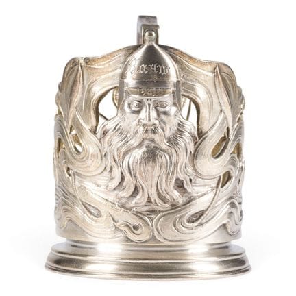 AN ART NOUVEAU SILVER TEA-GLASS HOLDER WITH A BOGA