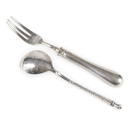 A SPOON AND FORK FROM THE FAMILY COLLECTION OF THE