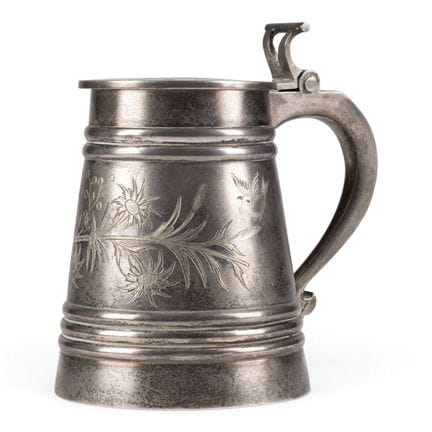 A SILVER TANKARD WITH BIRDS AND FLOWERING BRANCHES