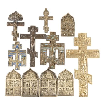 A COLLECTION OF EIGHT BRASS ICONS DEPICTING CRUCIF