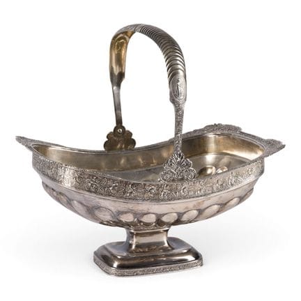 A LARGE SILVER BASKET WITH HANDLE AND ROSE BORDER 