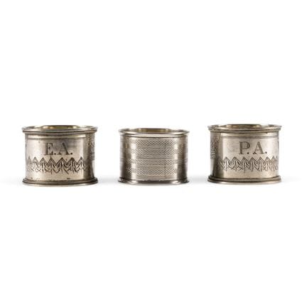 THREE SILVER NAPKIN RINGS WITH ENGRAVED DECORATION