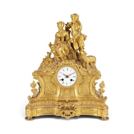 A GILT-BRONZE CLOCK SHOWING A GALANT SCENE Russian