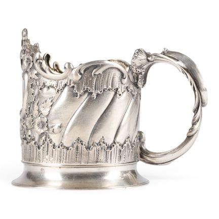 A MASSIVE SILVER TEA-GLASS HOLDER WITH A ROCAILLE 