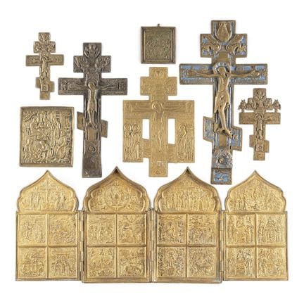A COLLECTION OF EIGHT BRASS ICONS DEPICTING CRUCIF