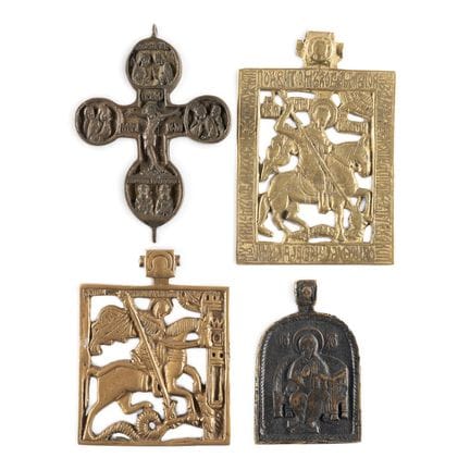 A COLLECTION OF FOUR BRASS ICONS DEPICTING CRUCIFI