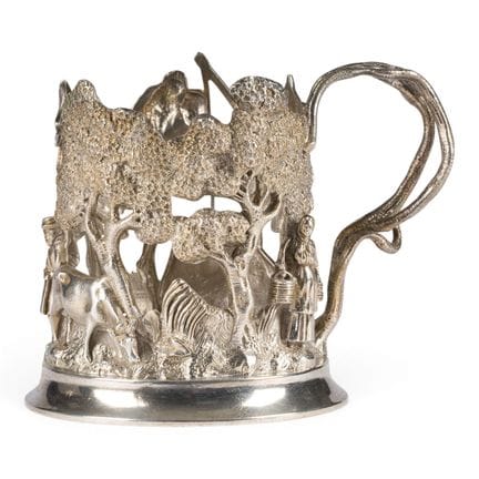 A MASSIVE SILVER TEA-GLASS HOLDER WITH A PEASANT C