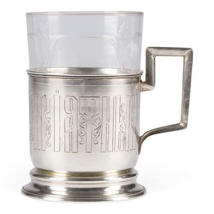 A SILVER TEA-GLASS HOLDER WITH CYRILLIC INSCRIPTIO