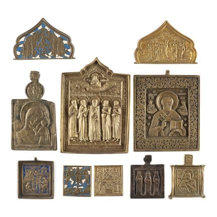 A COLLECTION OF TEN BRASS ICONS DEPICTING IMAGES O