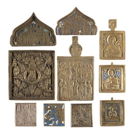 A COLLECTION OF TEN BRASS ICONS DEPICTING IMAGES O