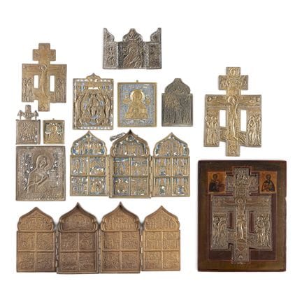 A COLLECTION OF ELEVEN BRASS ICONS AND A STAUROTHE