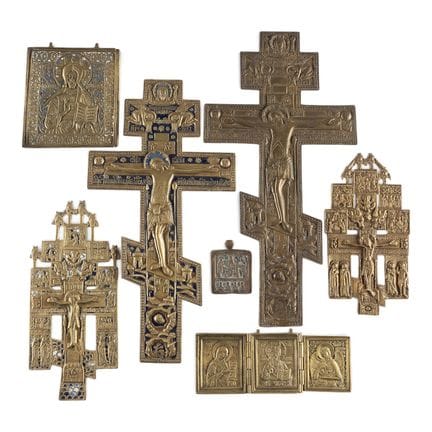 A COLLECTION OF SEVEN BRASS ICONS DEPICTING CRUCIF