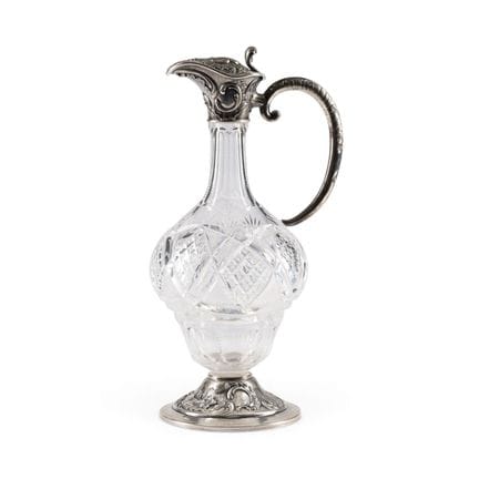 A SILVER-MOUNTED CUT-GLASS DECANTER WITH ROCAILLES