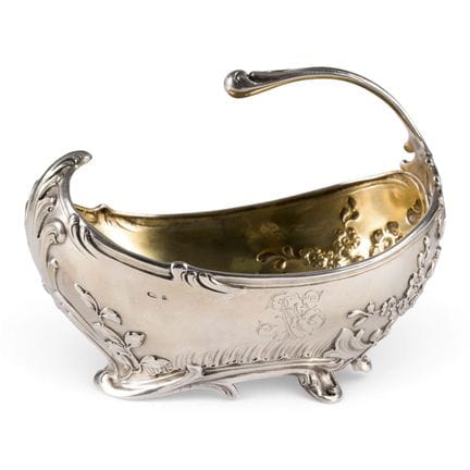 A LARGE SILVER BOWL WITH HANDLE, FOLIATE DECORATIO