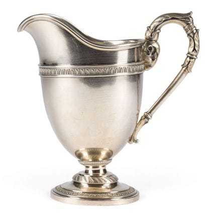 A SILVER CREAM JUG WITH RAM'S-HEAD HANDLE Russian,