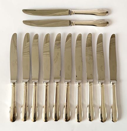 CHRISTOFLE 
Modell Cluny
12er-Set Tischmesser aus 