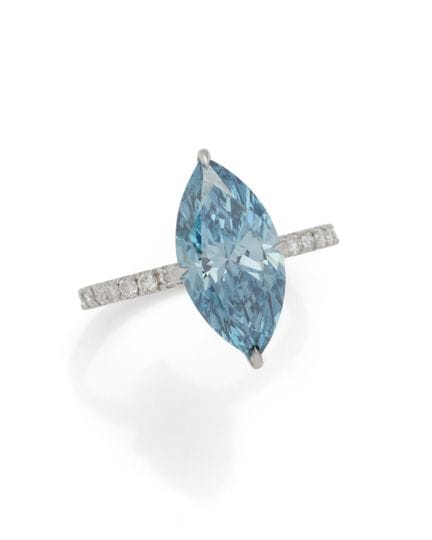 BAGUE-SOLITAIRE en or gris 18K (750/1000) surmonté