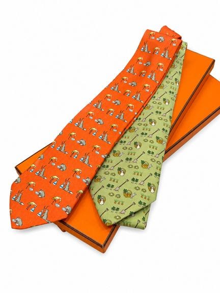 Hermès Paris 
Set of two silk ties featuring garde