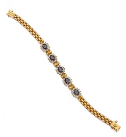 BRACELET en or jaune 18 K (750/1000) orné de 5 mar