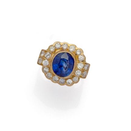 BAGUE en or jaune rhodié 18K (750/1000) centrée d'