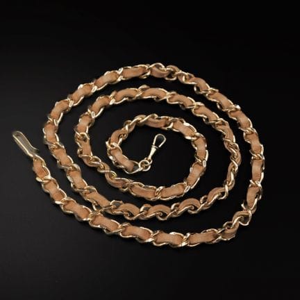 CHANEL
Gold-tone metal belt interwoven with natura